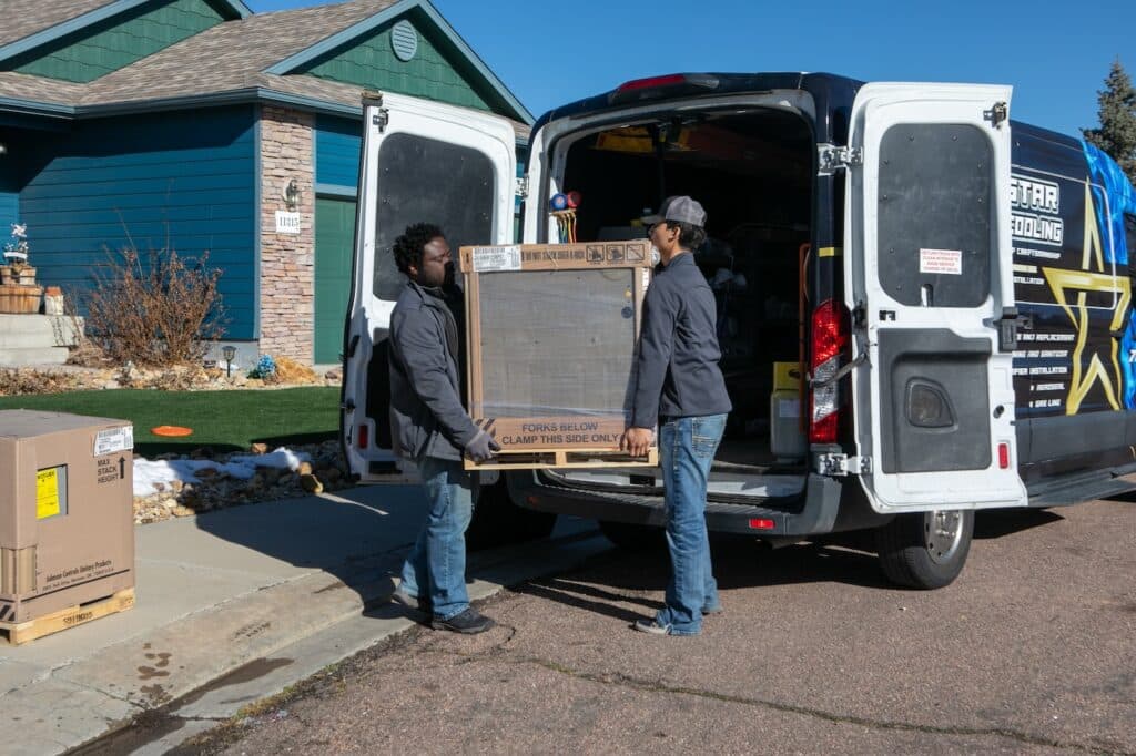 Furnace Technicians delivering a new furnace